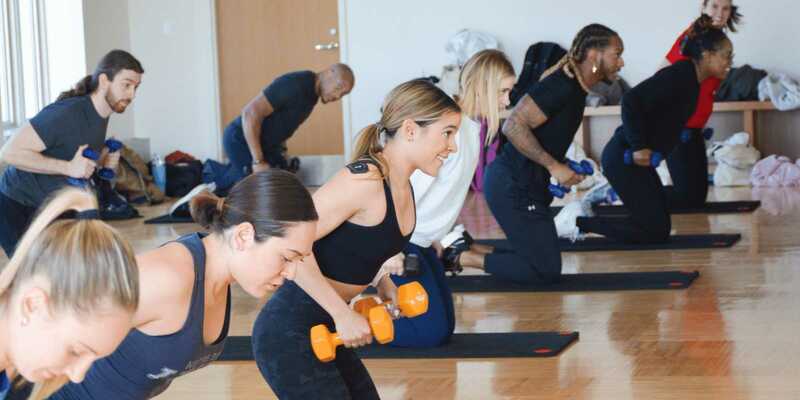 Group Fitness Class with Dumbbells